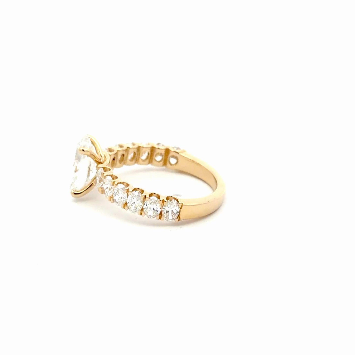 Oval Diamond Engagement Ring with oval diamonds band